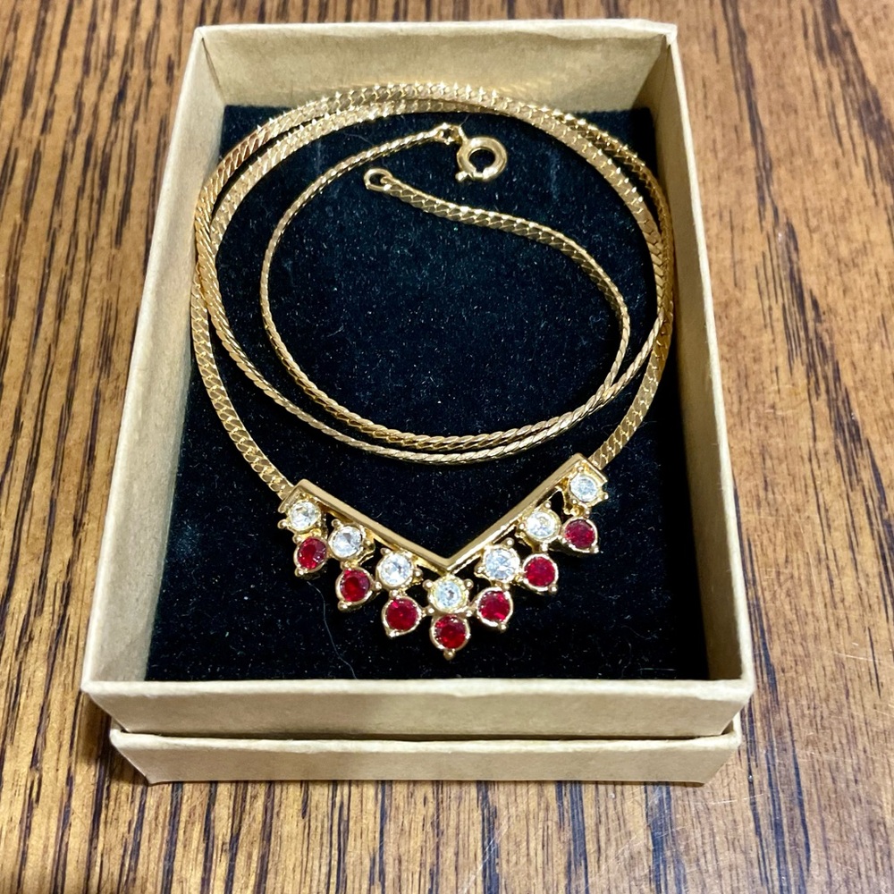 Beautiful vintage Avon V shaped gold tone necklace with red and white stones